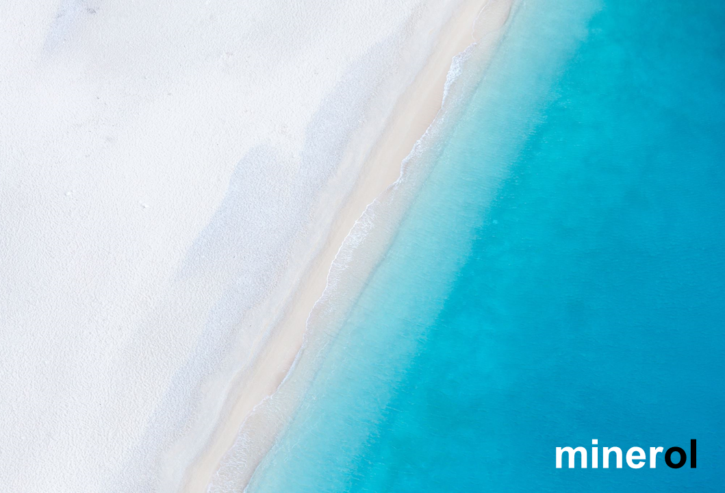 Turquoise sea meeting a white sand beach
